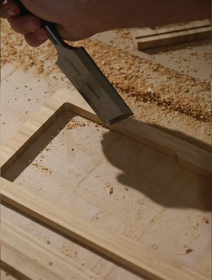 The stand opened on a wooden workshop bench