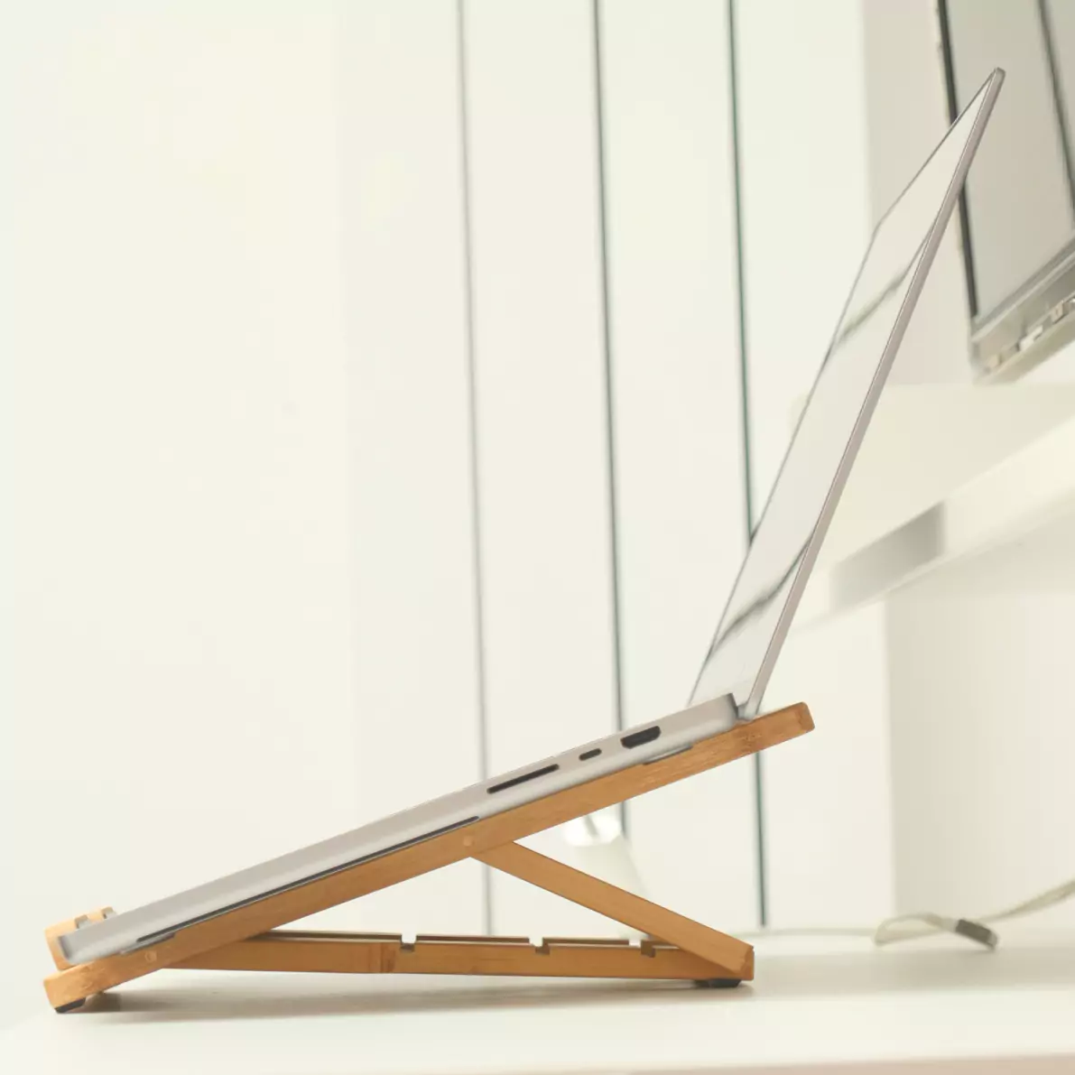 The Levelty folding bamboo laptop stand